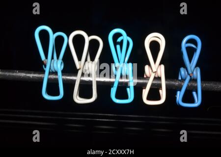 Some cloth clips hanging on a wire in a house roof of Kathmandu, Nepal. Stock Photo