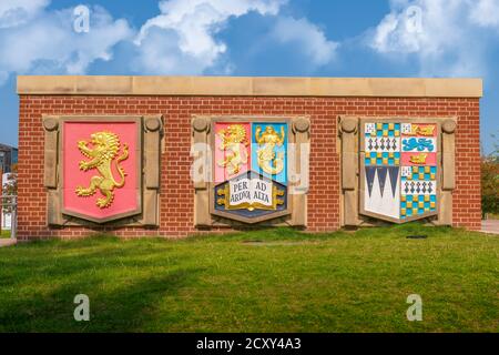 The University of Birmingham Crests on campus against a blue sky. Stock Photo