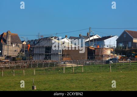 Progress on the construction of Ogmore by sea village hall on the main road through this small seaside village. Stock Photo