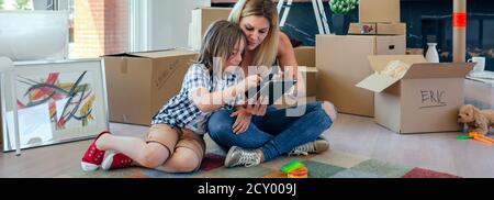 Mother and son playing the tablet Stock Photo
