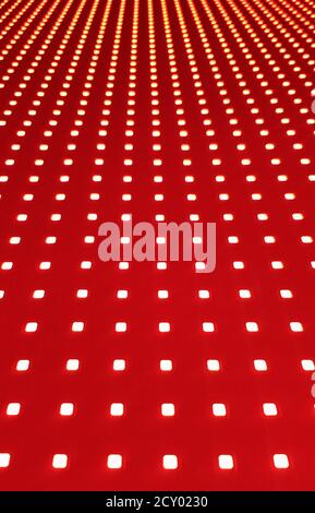 RGB LED screen panel texture. Close-up of a pixel LED screen with bokeh for wallpaper. Bright red abstract background perfect for any design Stock Photo
