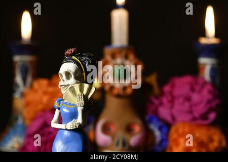 Closeup shot of plastic skulls female figurine for an offering of the day of the dead Stock Photo