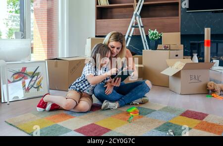 Mother and son playing the tablet Stock Photo