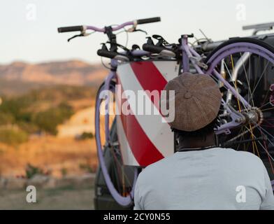 African American black man with a bicycles in his camper van Stock Photo