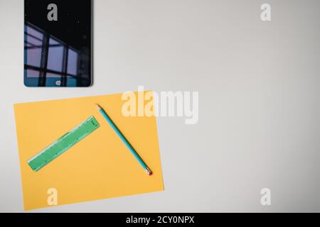distance learning tablet and materials on white background Stock Photo