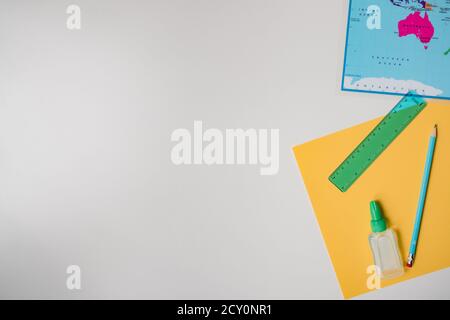 education materials with map, paper, pencil on white background Stock Photo