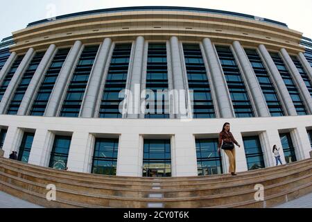 A woman walks down the steps in front of Romania's National Library during its official opening ceremony in Bucharest April 23, 2012. Opened in a refurbished communist era building, Romania's National Library has a fund of more than 12 million books. REUTERS/Bogdan Cristel (ROMANIA - Tags: SOCIETY EDUCATION)
