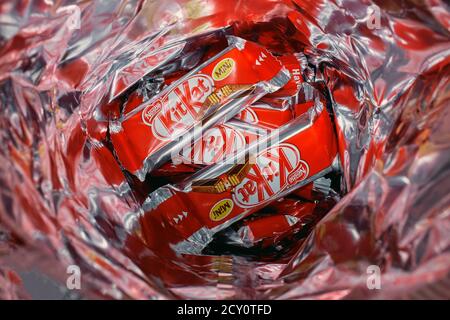 Mini Kit-Kat bars and wrappers inside a non recyclable foil packaging - chocolate sweet brand Stock Photo