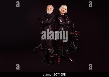 Photo of two pensioners people family cool aged lady man rock band group all life together concert show drum instruments wear trendy rocker leather Stock Photo