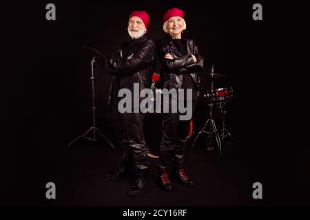 Full length photo of two pensioners family cool aged lady man rock group all life together concert show drum instruments wear trendy rocker leather Stock Photo