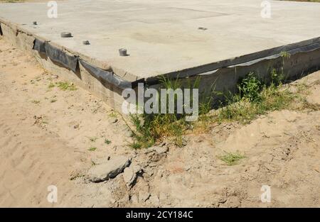 slab-on-grade foundation on construction site. busy construction site ...