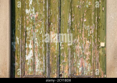 Close-up of an old door with peeled and weathered wood Stock Photo