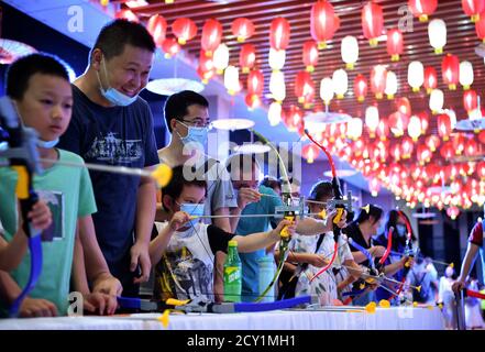 Haikou, China's Hainan Province. 1st Oct, 2020. Visitors experience archery during an event to celebrate the Mid-Autumn Festival in Hainan Museum in Haikou, capital of south China's Hainan Province, Oct. 1, 2020. Credit: Guo Cheng/Xinhua/Alamy Live News Stock Photo