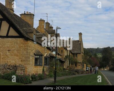Typical Cotswold stone houses along the road through the English ...