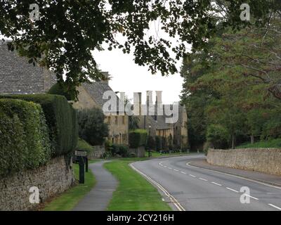 Typical Cotswold stone houses along the road through the English ...