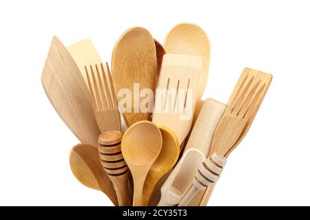 Wooden kitchen utensils isolated on white background. Stock Photo