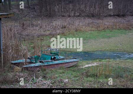 Old water bicycle on a dried lake in a park in winter. Mankivka, Ukraine Stock Photo