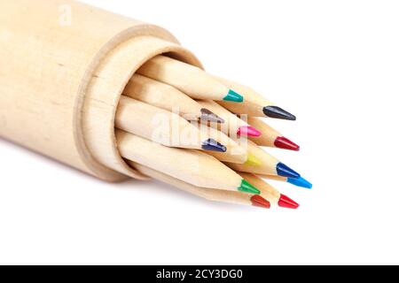 Colored pencils in a wooden box isolated on white background. Stock Photo