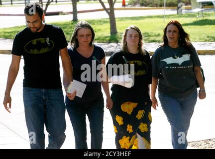 Victims and family of victims wearing Batman clothes arrive for the second court appearance of James Holmes, in Centennial, Colorado July 30, 2012. The former graduate student accused of killing 12 people in a shooting spree at a Denver-area movie house was due to make a second court appearance on Monday as prosecutors and defense lawyers sparred over a mysterious package sent to his psychiatrist.  James Holmes, 24, was arrested shortly after prosecutors say he opened fire at a packed midnight movie premiere of 'A Dark Knight Rises' on July 20.  REUTERS/Rick Wilking (UNITED STATES - Tags: DISA