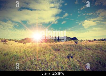 Vintage photo of beautiful landscape with autumn meadow. Poland countryside. Stock Photo