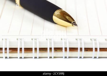 Automatic ballpoint pen and notepad isolated on white background. Stock Photo