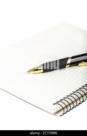 Automatic ballpoint pen and notepad isolated on white background. Stock Photo