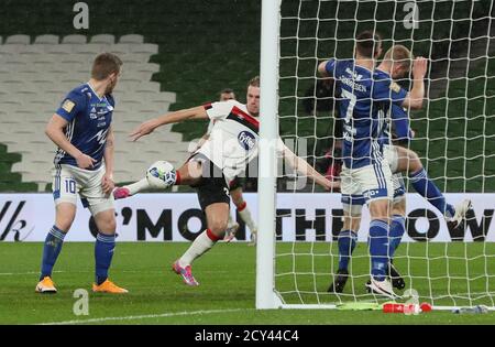 Dundalk's Daniel Cleary (second left) scores his side's second goal of the game during the Europa League playoff match at the Aviva Stadium, Dublin. Stock Photo