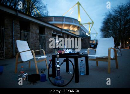 Chairs and a table are pictured in front of the Signal Iduna Park stadium of Borussia Dortmund in Dortmund April 16, 2013. More than 1,000 supporters of Borussia Dortmund spent the night to stand in line to get a ticket for the Champions League first leg semi-final soccer match between Borussia Dortmund and Real Madrid on April 24 in Dortmund.  REUTERS/Ina Fassbender  (GERMANY - Tags: SPORT SOCCER)