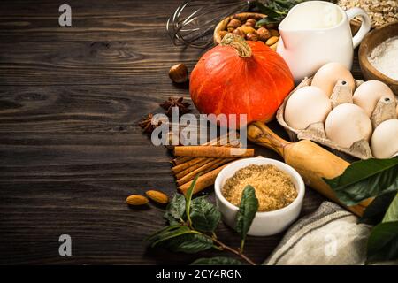 Fall baking ingredients on kitchen table. Stock Photo