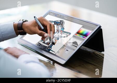 African American Designer Using Tablet  Computer In Office Stock Photo