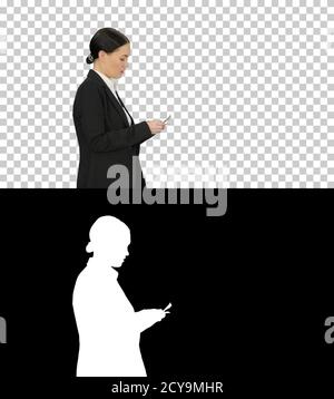 Young woman in a suit counting money, Alpha Channel with Silhoue Stock Photo