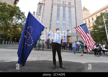 [File] A Member of the New Federal State of China seen outside Manhattan Federal Court during the arraignment of former adviser to President Donald J. Trump, Steve Bannon, arrested on charges of conspiracy to commit fraud in connection to his We Build the Wall fundraising campaign that was to help build a border wall between the United States and Mexico, New York, NY on August 20, 2020. The New Federal State of China was created by Stephen Bannon and Guo Wengui, a self-declared government in exile with the purpose to “overthrow the Chinese government”. (Anthony Behar/Sipa USA) Stock Photo