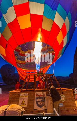 Goreme, Turkey - April 6, 2016 - Pilot fires the heater in his hot air  balloon as he prepares it for flight Stock Photo - Alamy