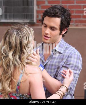 Hilary Duff and Penn Badgley on the set of CW's 'Gossip Girl' in New York City on August 26, 2009.  Photo Credit: Henry McGee/MediaPunch Stock Photo