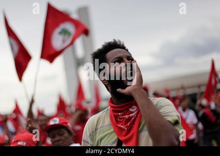 A member of the Landless Workers Movement (MST) reacts during a protest march against Brazil's President Dilma Rousseff through the streets of Brasilia February 12, 2014. REUTERS/Ueslei Marcelino (BRAZIL - Tags: POLITICS CIVIL UNREST)