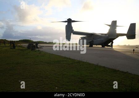 U.S. Marines with Bulk Fuel Company, 9th Engineer Support Battalion (ESB), 3rd Marine Logistics Group (MLG) prepare to refuel an MV-22B Osprey at Ie Shima, Okinawa, Japan, Sept. 23, 2020. During the exercise Bulk Fuel Company, 9th ESB set fuel lines and manned the stations for a Forward Arming and Refueling Point in support of UH-1Y Venom, AH-1Z Viper, and MV-22B Osprey aircraft with 1st Marine Aircraft Wing, and U.S. Army UH-60 Black Hawks. 3rd MLG provides III Marine Expeditionary Force comprehensive logistics and combat service support for operations throughout the Indo-Pacific area of resp Stock Photo