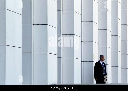 A guard stands in front of Romania's National Library during its official opening ceremony in Bucharest April 23, 2012. Opened in a refurbished communist era building, Romania's National Library has a fund of more than 12 million books. REUTERS/Bogdan Cristel (ROMANIA - Tags: SOCIETY EDUCATION)