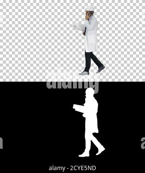Successful architect is talking on the mobile phone and walking, Stock Photo