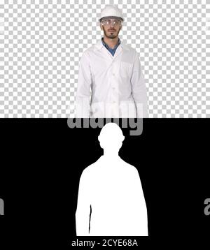 Science engineer walking in safety helmet and glasses, Alpha Cha Stock Photo