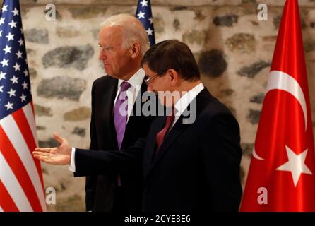 Turkey's Prime Minister Ahmet Davutoglu (R) and U.S. Vice President Joe Biden arrive at their meeting in Istanbul November 21, 2014. Turkey and the United States played down differences in the fight against Islamic State on Friday, but Prime Minister Ahmet Davutoglu made clear Ankara would keep pressing for a no-fly zone in Syria and President Bashar al-Assad's removal. REUTERS/Murad Sezer (TURKEY - Tags: POLITICS)
