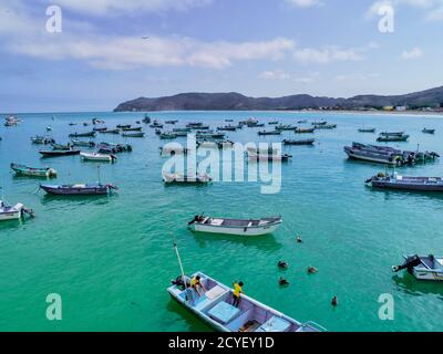 Puerto Lopez, Ecuador - September 12, 2018 - drone aerial view of fishing boats moored in the bay at the end of the work day Stock Photo