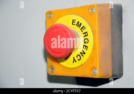 Big Red emergency button or stop button for manual pressing. STOP button for industrial equipment, emergency stop. Red light. At the factory and Stock Photo