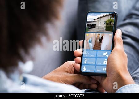 Smart Home CCTV Security On Mobile Phone Or Smartphone Stock Photo