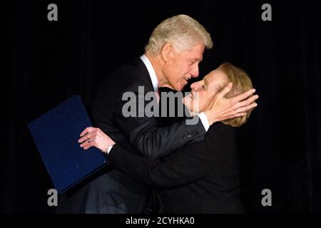 Former U.S. President Bill Clinton greets Former Secretary of State Madeleine Albright on stage at the Annual Freedom Award Benefit Event hosted by the International Rescue Committee at the Waldorf-Astoria in New York  November 6, 2013. This year's event honored philanthropist and businessman, George Soros. REUTERS/Andrew Kelly (UNITED STATES - Tags: POLITICS SOCIETY TPX IMAGES OF THE DAY)