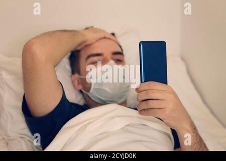 boring patient using smartphone while resting in hospital bed. sick patient admit to hospital for medical treatment. Rehabilitation Health care Stock Photo