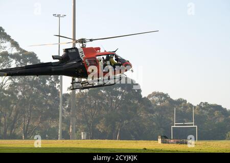 East Killara, New South Wales, Australia. 2nd Oct, 2020. Australia: Bushfire hazard reduction burns taking place in the Sydney suburb East Killara. Pictured is the NSW National Parks & Wildlife Service firefighting helicopter. Credit: mjmediabox/Alamy Live News Stock Photo