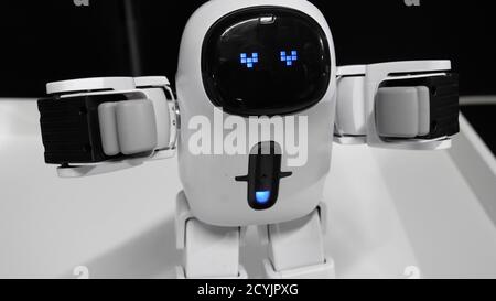 Modern robot with an electronic face with loving hearts eyes. Stock Photo