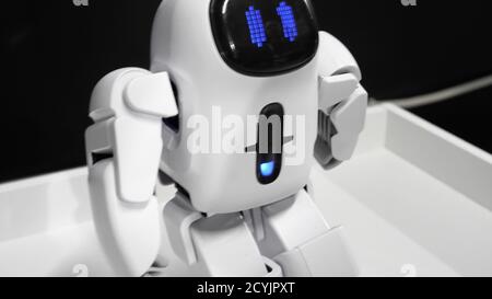 A little robot walking forward. Stock Photo