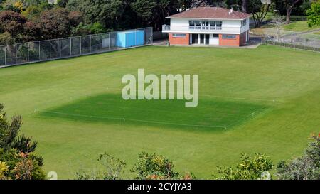 A cricket club's pitch in Anderson Park in the Wellington Botanic Garden, showing the effect of spring watering Stock Photo