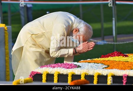 New Delhi, India. 2nd October, 2020. Indian Prime Minister Narendra Modi pays homage to Mahatma Gandhi on the occasion of his 151st  birth anniversary at Rajghat in New Delhi. Credit: PRASOU/Alamy Live News Stock Photo